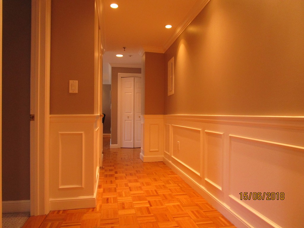 390 Commonwealth Avenue, Unit 210 Boston, MA 02215 - Photo 17 of 30 a view of a hallway with wooden cabinets