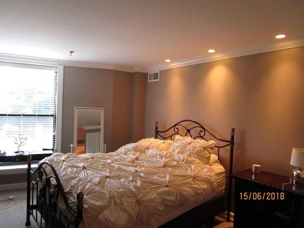 390 Commonwealth Avenue, Unit 210 Boston, MA 02215 - Photo 23 of 30 a bedroom with a bed and with a window