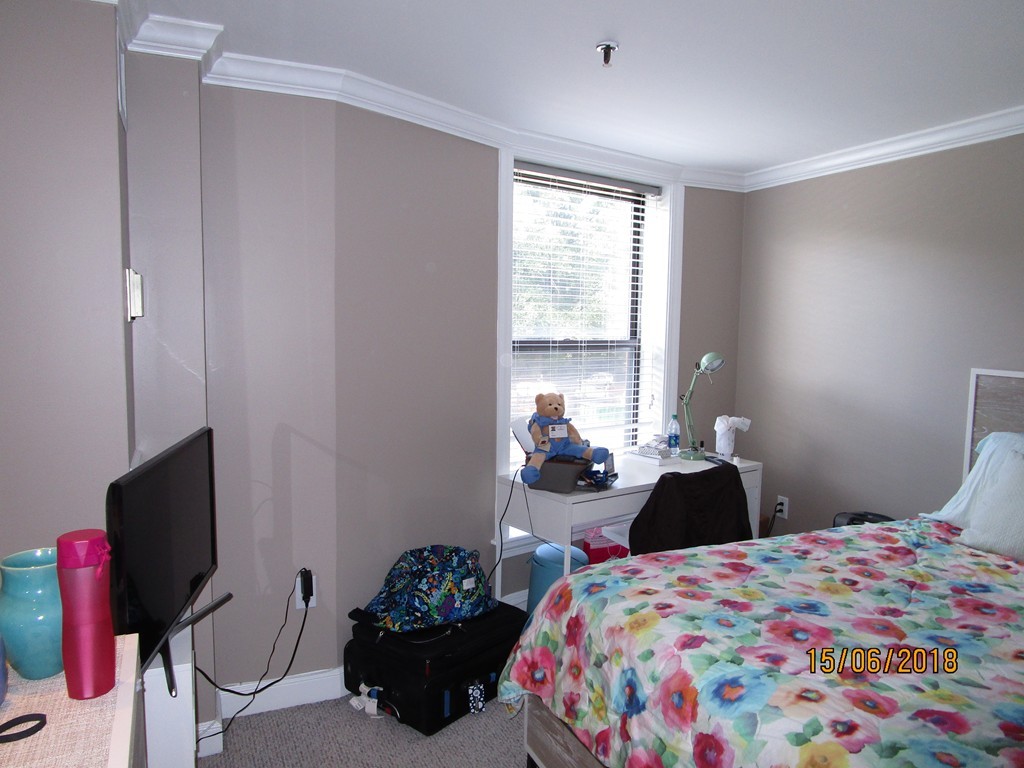 390 Commonwealth Avenue, Unit 210 Boston, MA 02215 - Photo 25 of 30 a bedroom with a bed and a window
