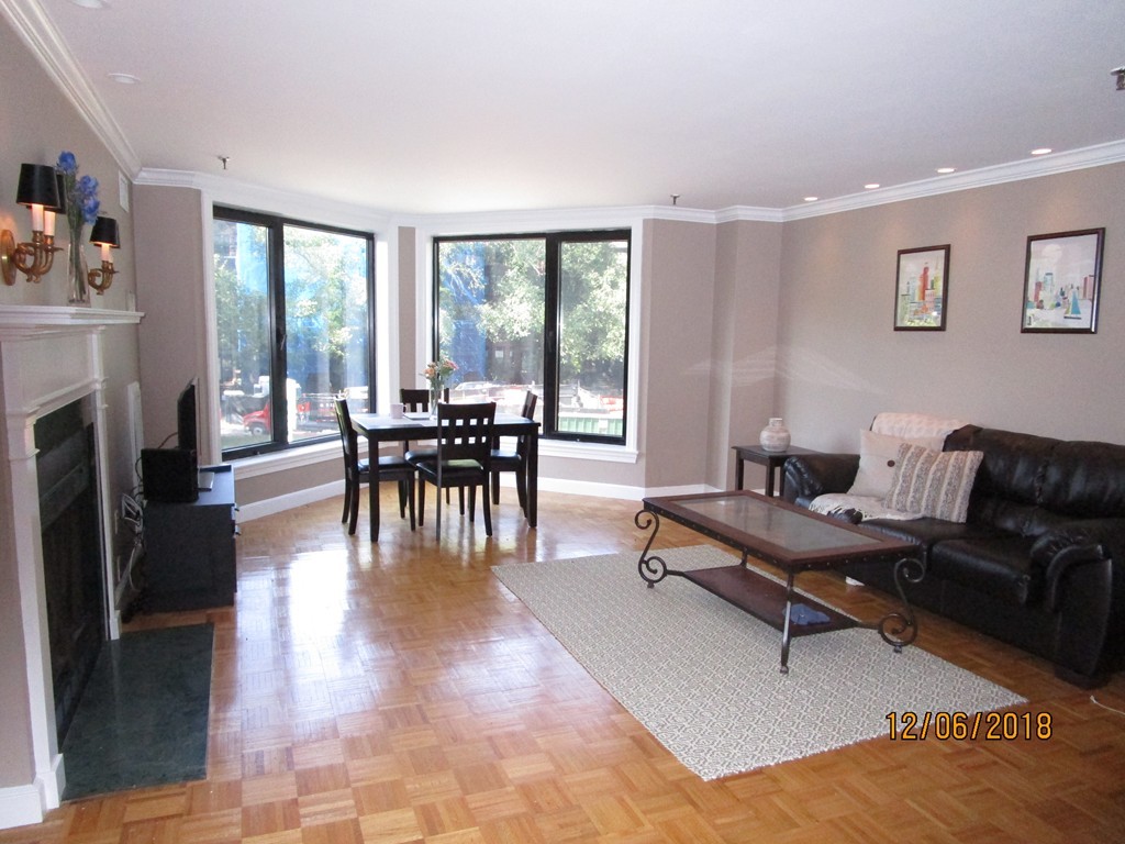 390 Commonwealth Avenue, Unit 210 Boston, MA 02215 - Photo 4 of 30 a living room with furniture and a fireplace
