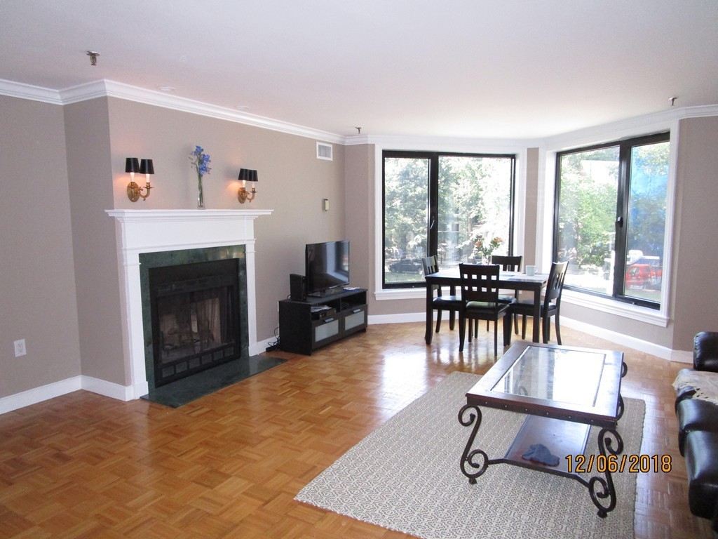 390 Commonwealth Avenue, Unit 210 Boston, MA 02215 - Photo 5 of 30 a view of a livingroom with furniture and a fireplace
