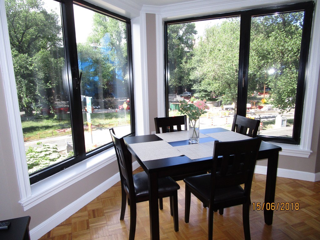 390 Commonwealth Avenue, Unit 210 Boston, MA 02215 - Photo 6 of 30 a view of a dining room with a table and chairs