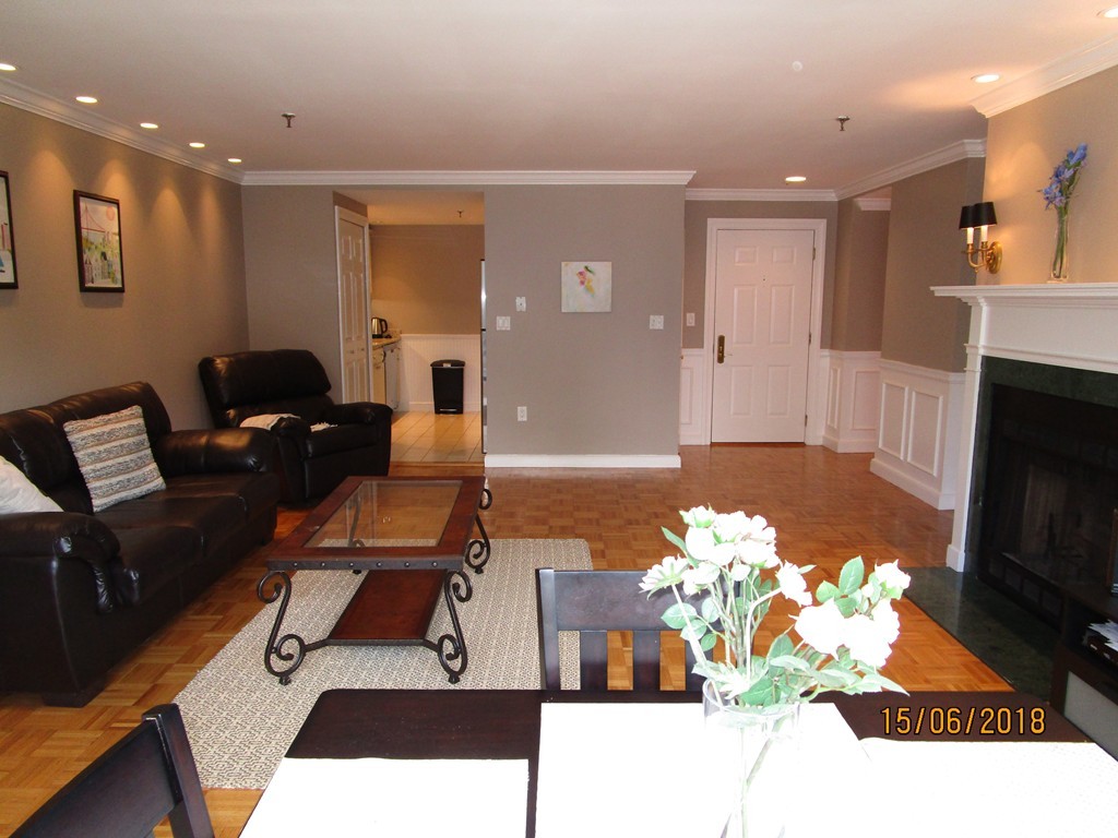 390 Commonwealth Avenue, Unit 210 Boston, MA 02215 - Photo 10 of 30 a living room with furniture and a flat screen tv