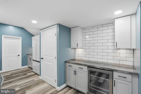 a kitchen with stainless steel appliances a stove and a refrigerator