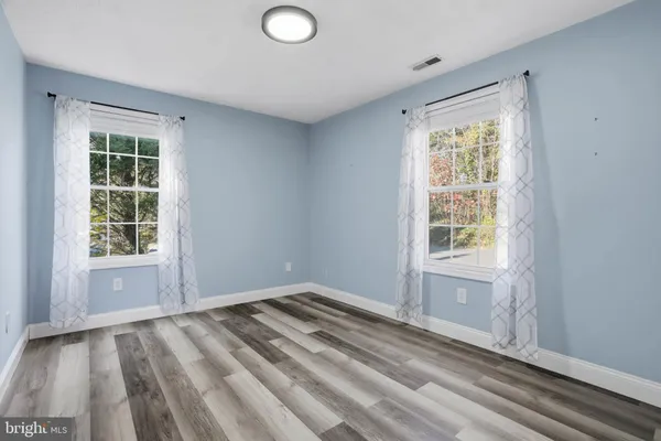 an empty room with windows