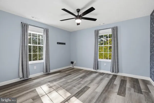 a view of empty room with windows