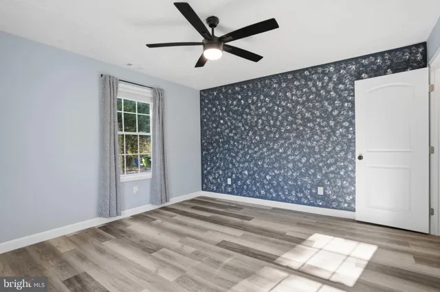 a view of empty room with windows