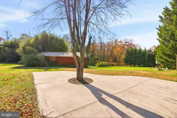 a view of a swimming pool with an outdoor space and seating area
