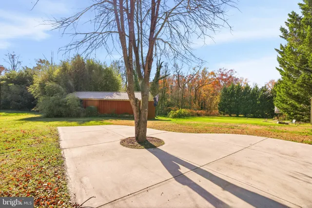 a view of a swimming pool with an outdoor space and seating area