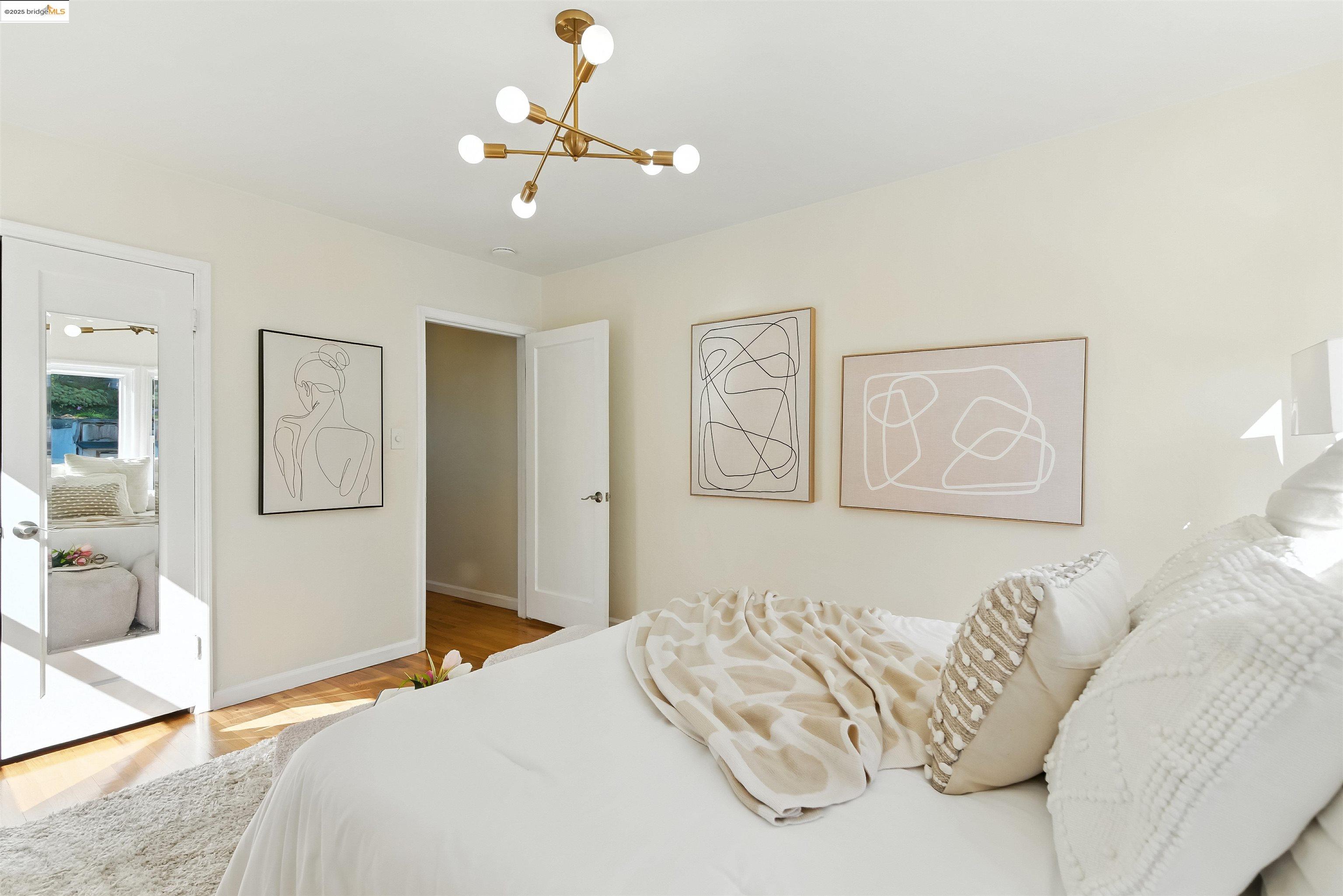 6623 Outlook Avenue Oakland, CA 94605 - Photo 18 of 38 Bedroom with a chandelier and light wood-type flooring