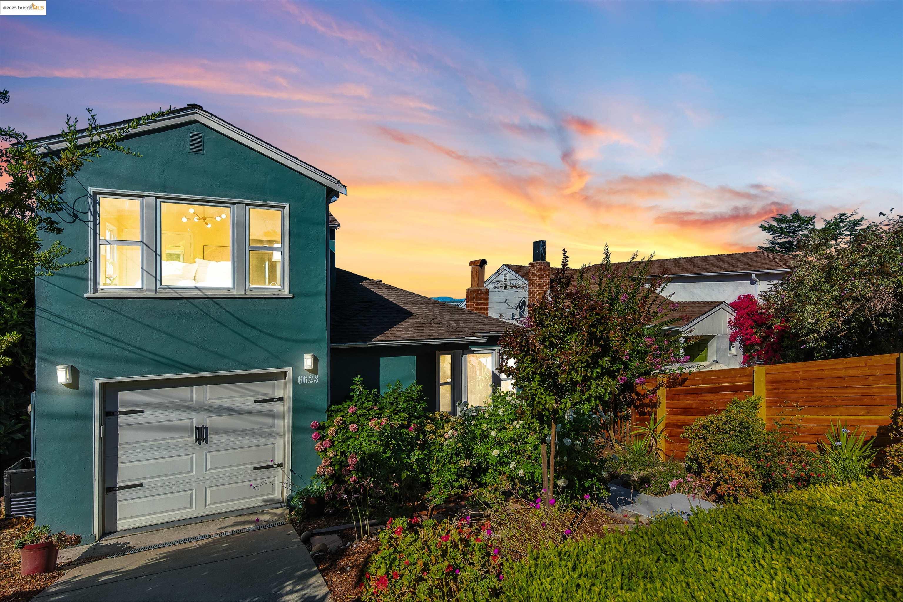 6623 Outlook Avenue Oakland, CA 94605 - Photo 34 of 38 Traditional home with stucco siding, concrete driveway, an attached garage, and a shingled roof
