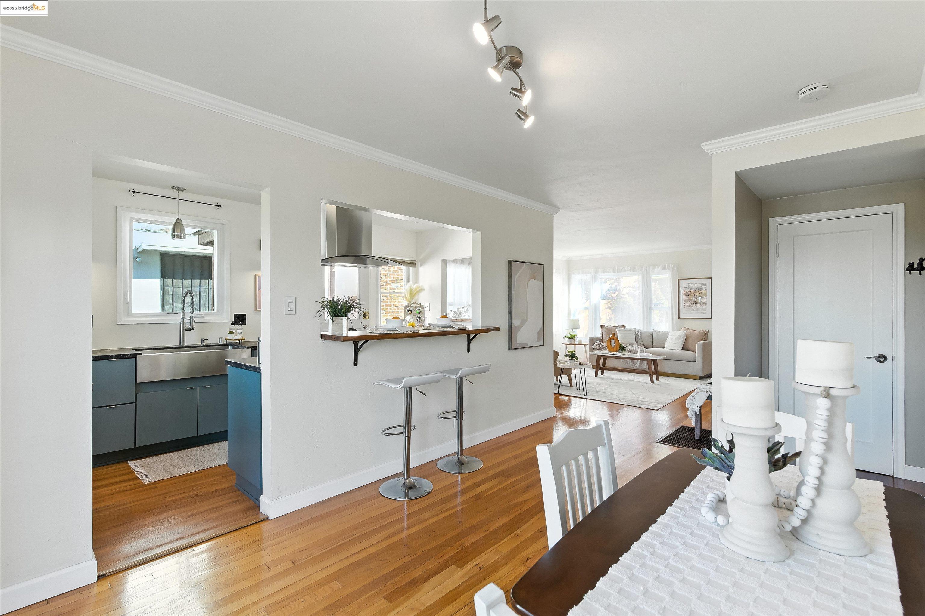6623 Outlook Avenue Oakland, CA 94605 - Photo 10 of 38 Dining room featuring crown molding and light wood-type flooring