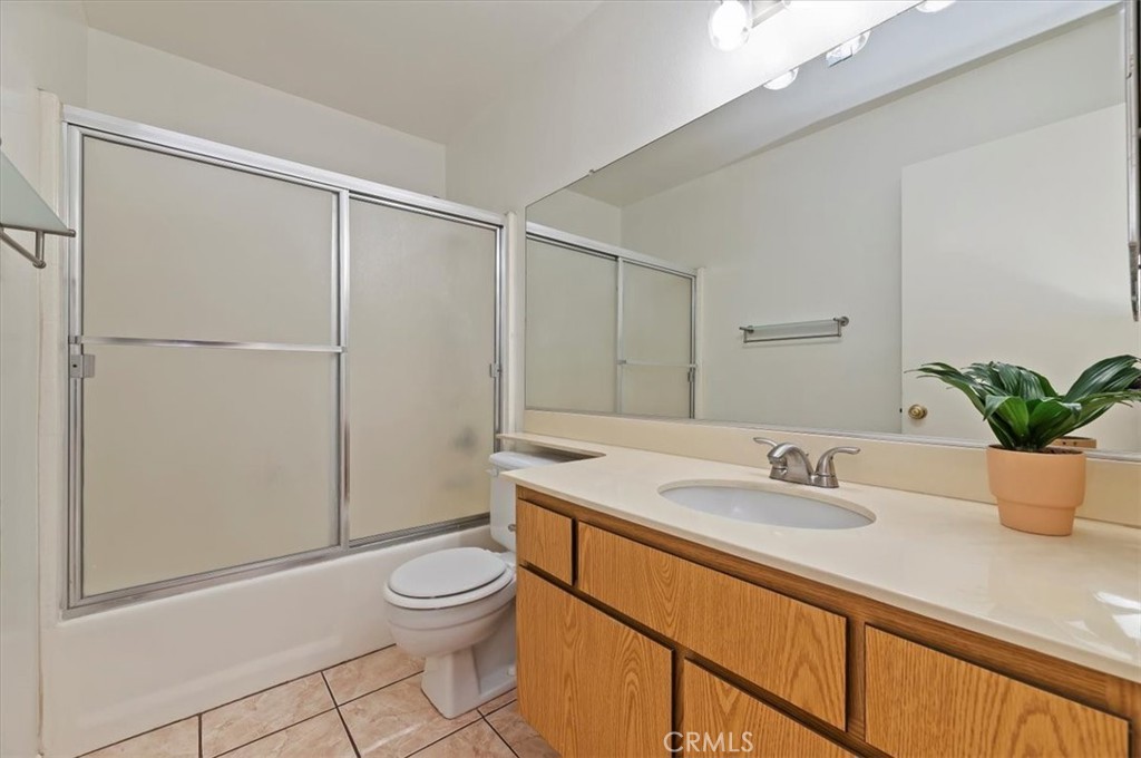 9765 Louise Way Rancho Cucamonga, CA 91730 - Photo 17 of 28 a bathroom with a sink a toilet and shower