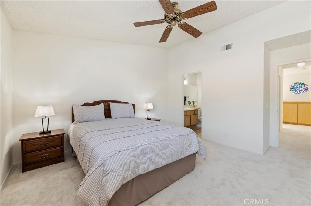 9765 Louise Way Rancho Cucamonga, CA 91730 - Photo 20 of 28 a bedroom with a bed and a night stand