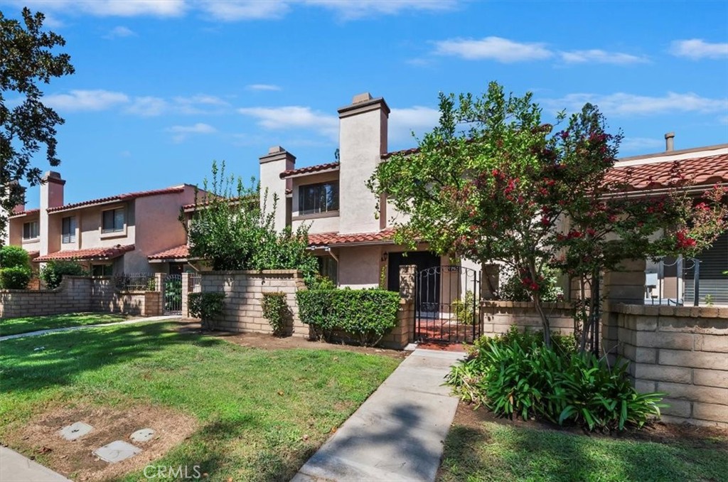 9765 Louise Way Rancho Cucamonga, CA 91730 - Photo 2 of 28 front view of a house with a yard