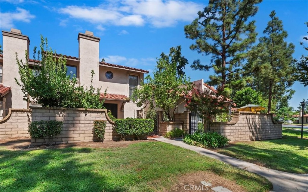 9765 Louise Way Rancho Cucamonga, CA 91730 - Photo 3 of 28 a view of a house with a yard and tree s