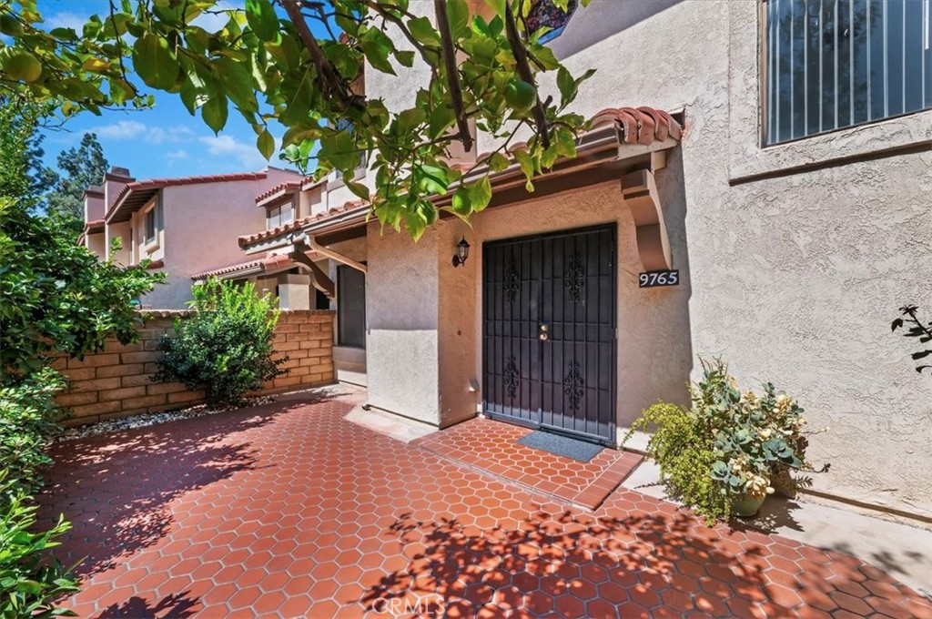 9765 Louise Way Rancho Cucamonga, CA 91730 - Photo 4 of 28 a front view of a house with a yard