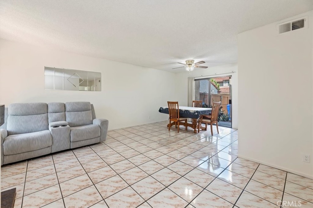 9765 Louise Way Rancho Cucamonga, CA 91730 - Photo 5 of 28 a living room with furniture and a chandelier