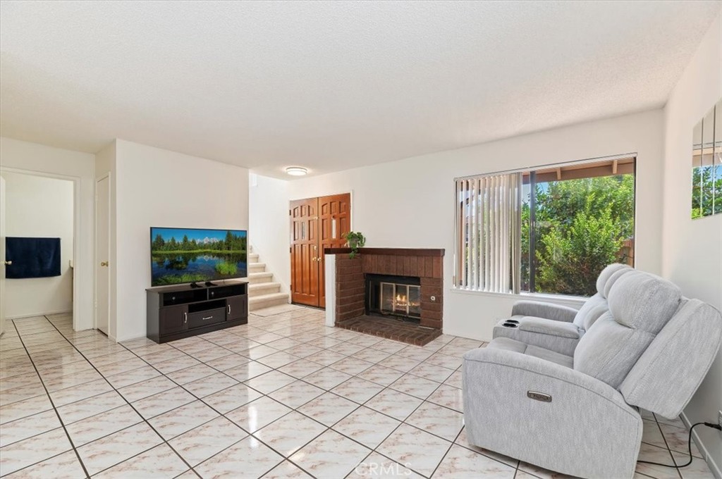 9765 Louise Way Rancho Cucamonga, CA 91730 - Photo 7 of 28 a living room with furniture and a flat screen tv