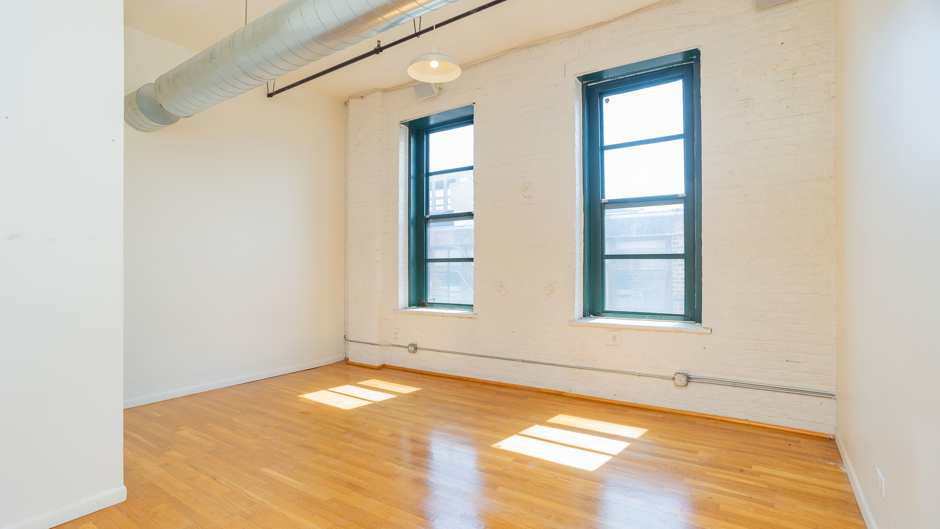 159 North Racine Avenue, Unit 2W Chicago, IL 60607 - Photo 7 of 11 a view of an empty room with window