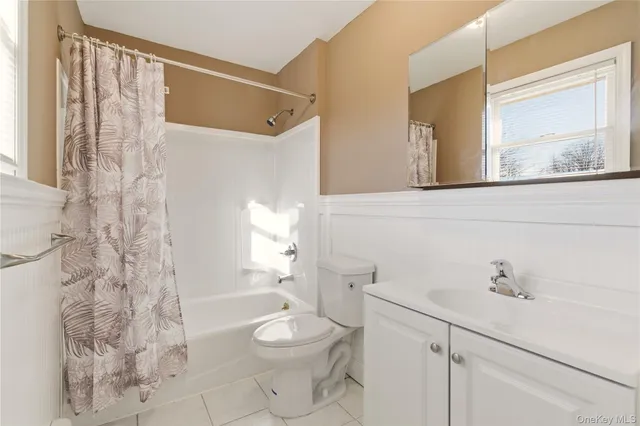 a bathroom with a toilet sink and shower