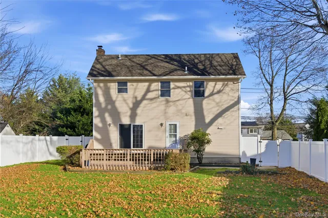 a view of a house with backyard porch and sitting area