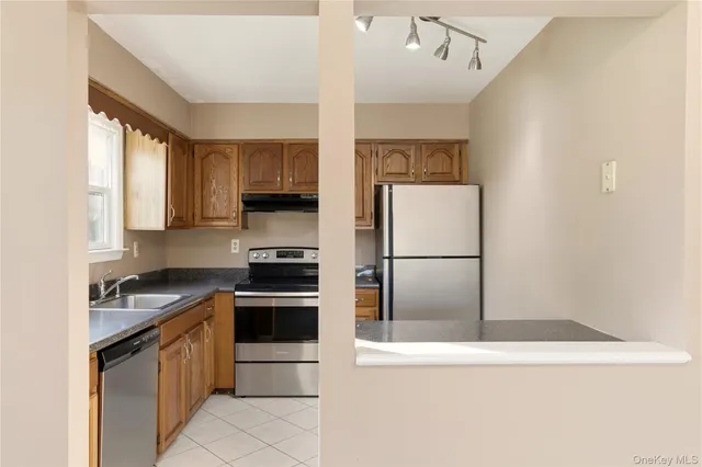 a kitchen with a refrigerator a stove a microwave and a refrigerator