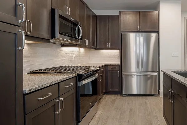 a kitchen with a stove microwave and refrigerator