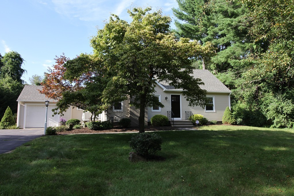68 Mill Road East Longmeadow, MA 01028 - Photo 12 of 12 a large tree in front of a house with a yard