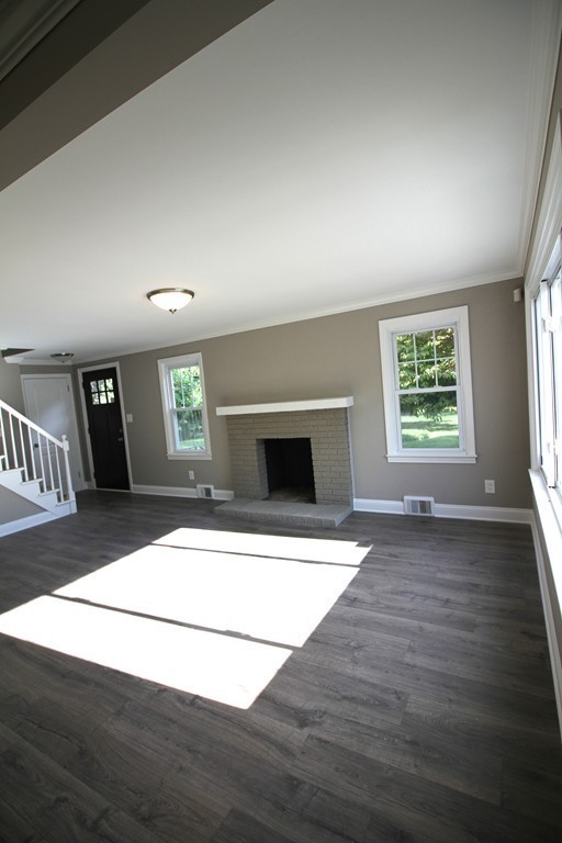 68 Mill Road East Longmeadow, MA 01028 - Photo 4 of 12 an empty room with windows and fireplace