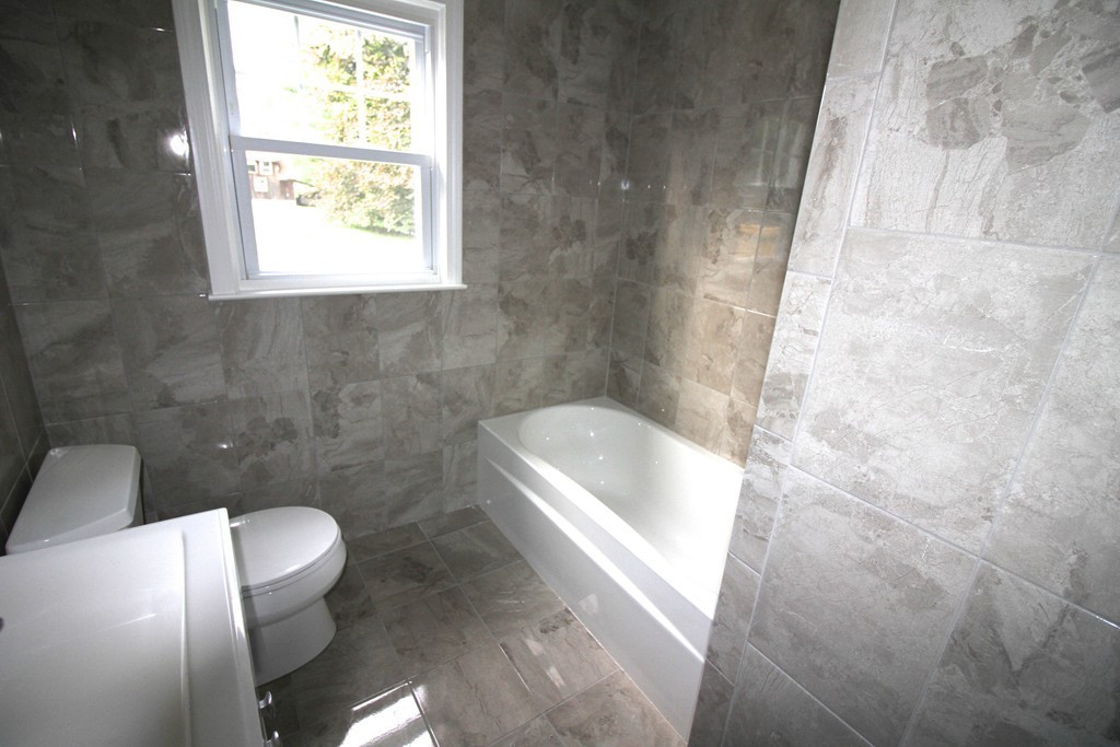 68 Mill Road East Longmeadow, MA 01028 - Photo 5 of 12 a bath tub sitting in a bathroom next to a toilet
