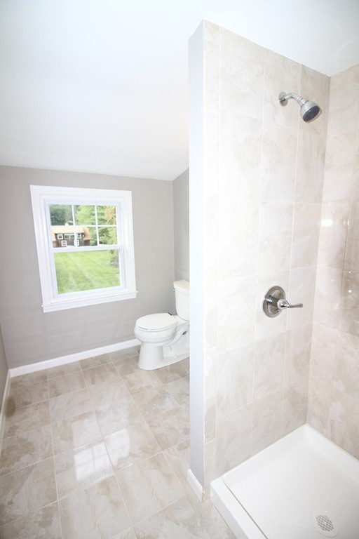 68 Mill Road East Longmeadow, MA 01028 - Photo 8 of 12 a bathroom with a granite countertop sink a toilet and shower