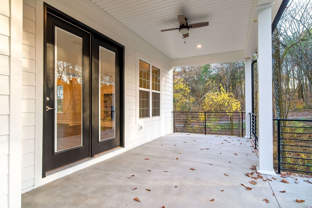 685 Wallace Road Gallatin, TN 37066 - Photo 23 of 64 a view of a porch with a floor to ceiling window