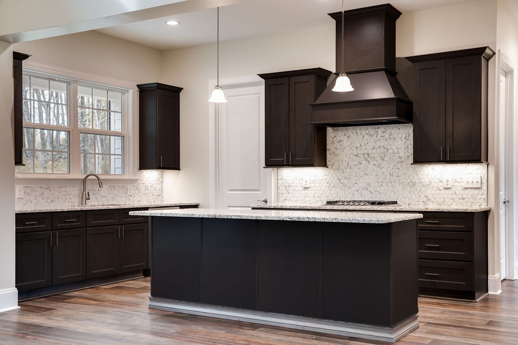 685 Wallace Road Gallatin, TN 37066 - Photo 24 of 64 a kitchen with stainless steel appliances a sink and cabinets