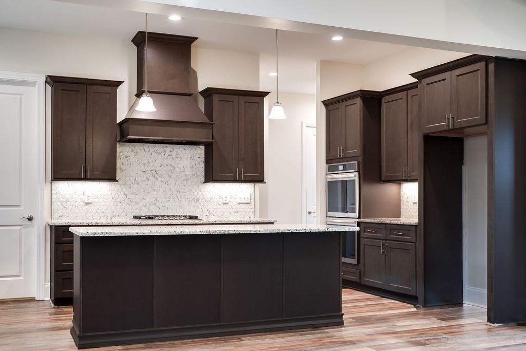685 Wallace Road Gallatin, TN 37066 - Photo 26 of 64 a kitchen with stainless steel appliances wooden cabinets and a counter top space