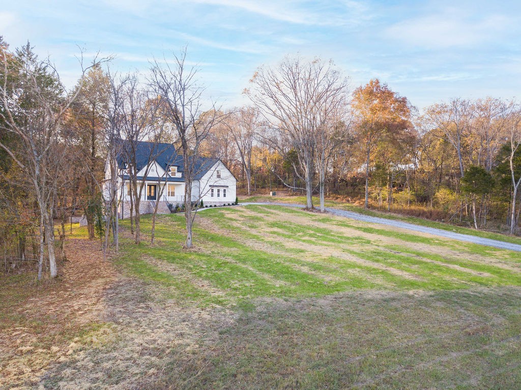 685 Wallace Road Gallatin, TN 37066 - Photo 3 of 64 a view of a house with a yard and a tree