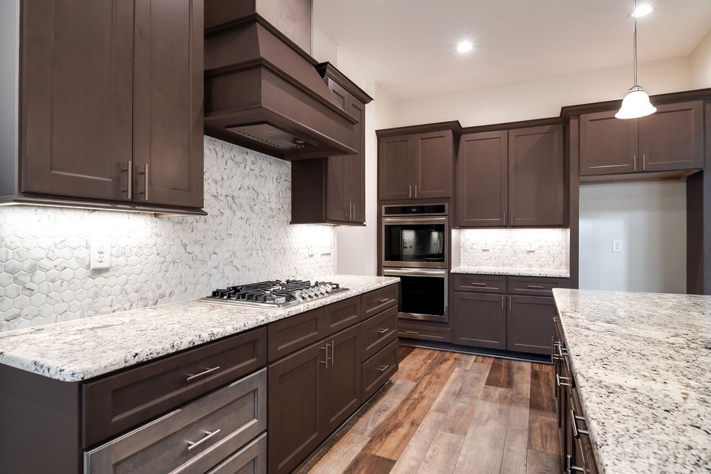 685 Wallace Road Gallatin, TN 37066 - Photo 40 of 64 a kitchen with granite countertop stainless steel appliances and wooden cabinets