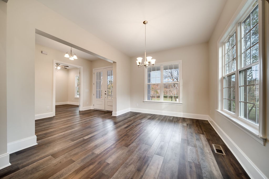 685 Wallace Road Gallatin, TN 37066 - Photo 44 of 64 a view of an empty room with wooden floor and a window