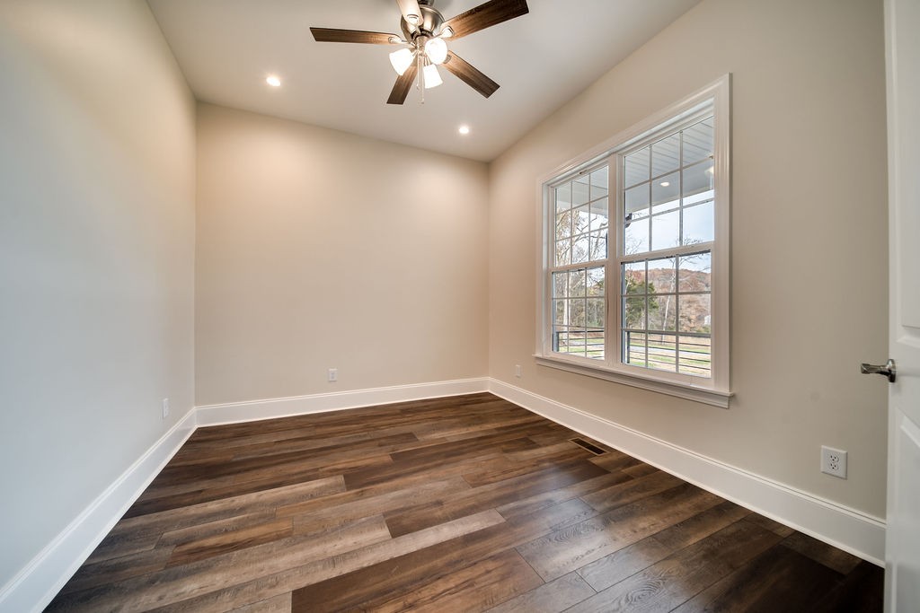 685 Wallace Road Gallatin, TN 37066 - Photo 45 of 64 a view of an empty room with wooden floor and a window