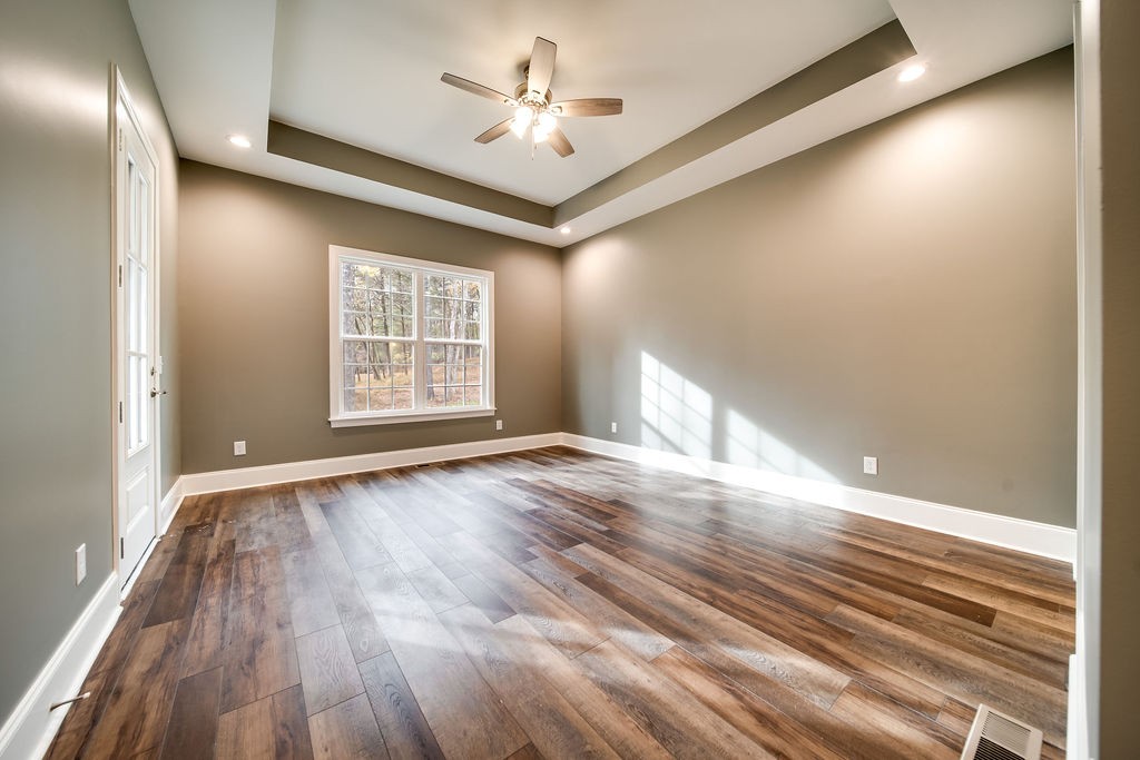 685 Wallace Road Gallatin, TN 37066 - Photo 49 of 64 a view of an empty room with a window and wooden floor
