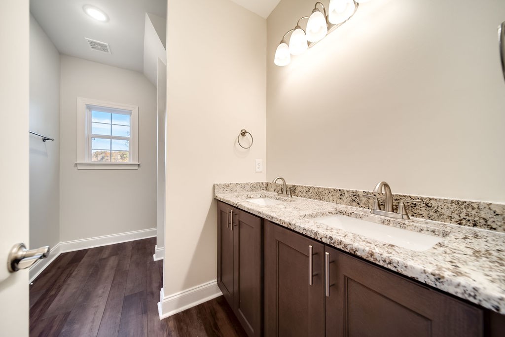 685 Wallace Road Gallatin, TN 37066 - Photo 54 of 64 a bathroom with a granite countertop sink and a mirror