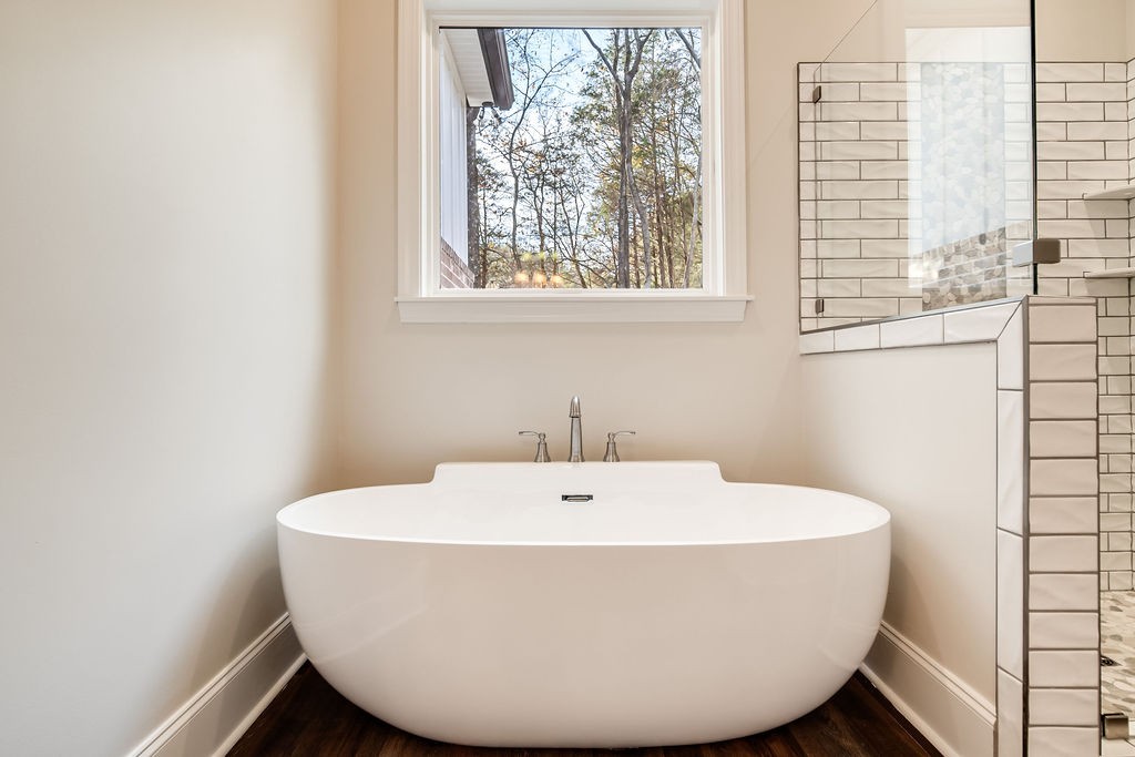 685 Wallace Road Gallatin, TN 37066 - Photo 56 of 64 a white bath tub sitting in a bathroom next to a window