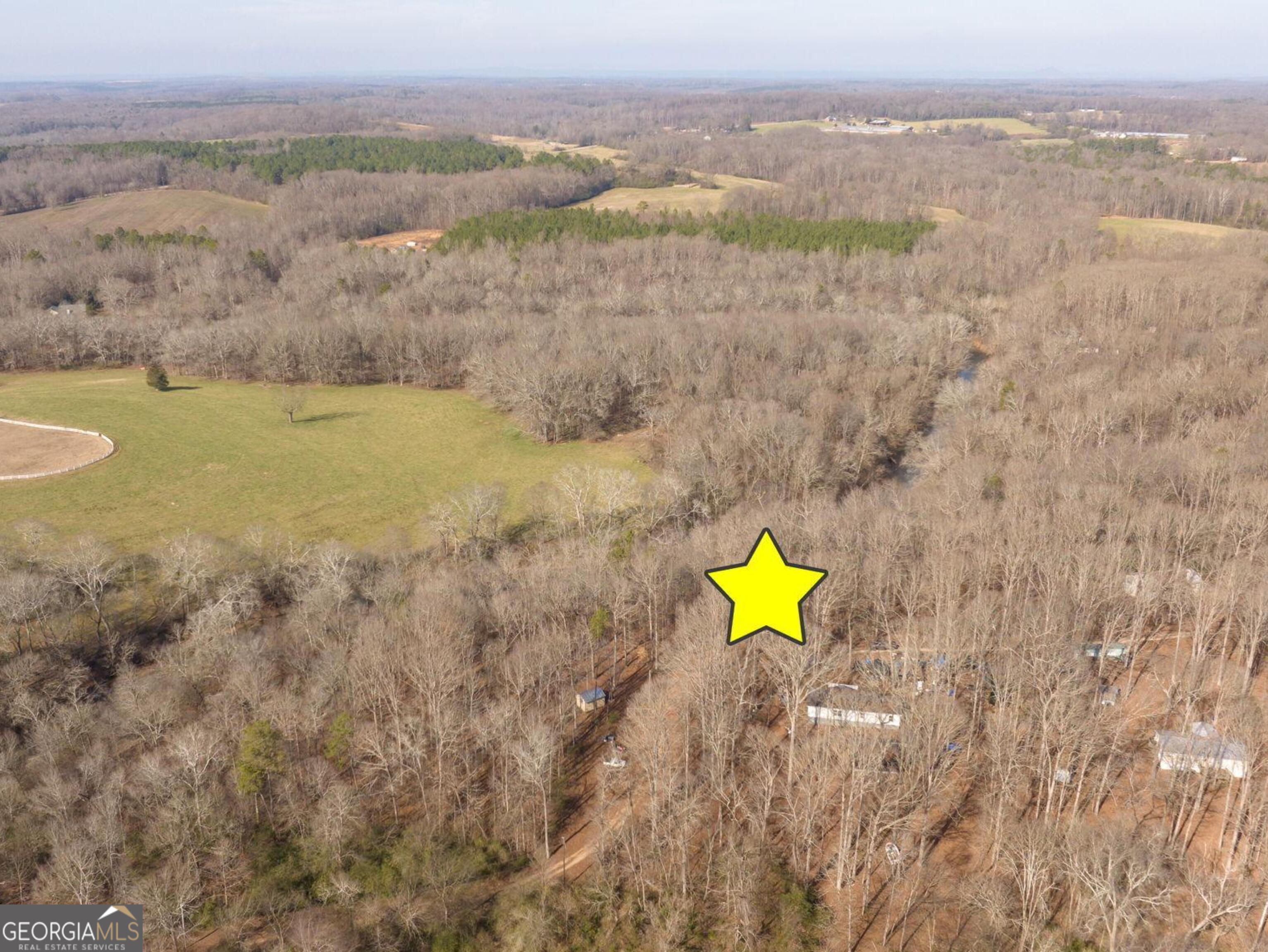 Lot 23-24 Tomlin Way Commerce, GA 30530 - Photo 17 of 42 a view of a lake with a mountain in the background
