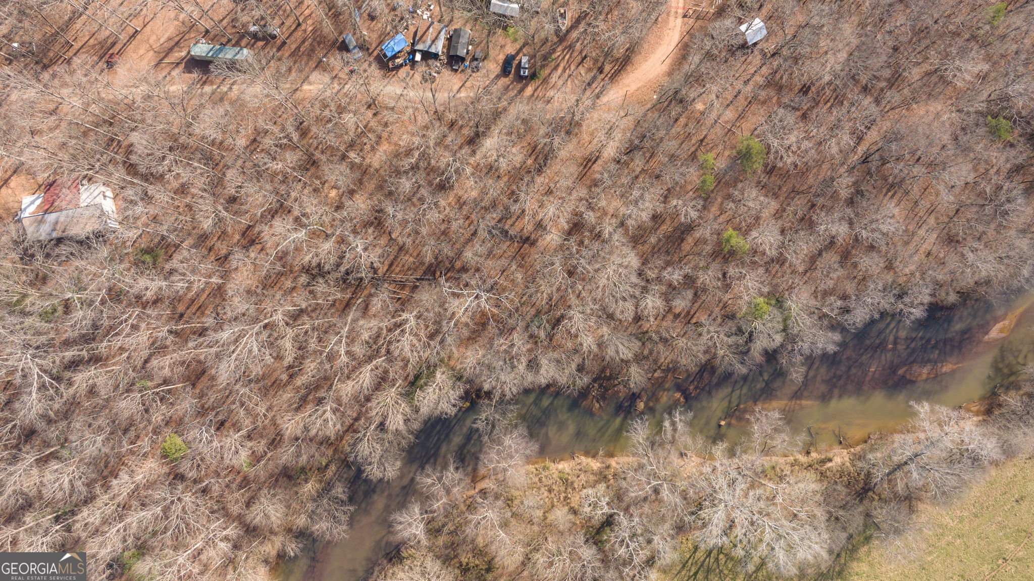 Lot 23-24 Tomlin Way Commerce, GA 30530 - Photo 27 of 42 a view of a lake in between the bunch of trees