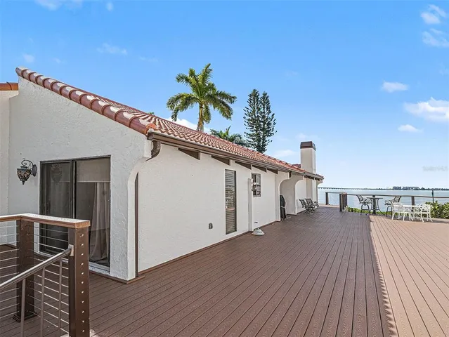 a view of a balcony with wooden floor