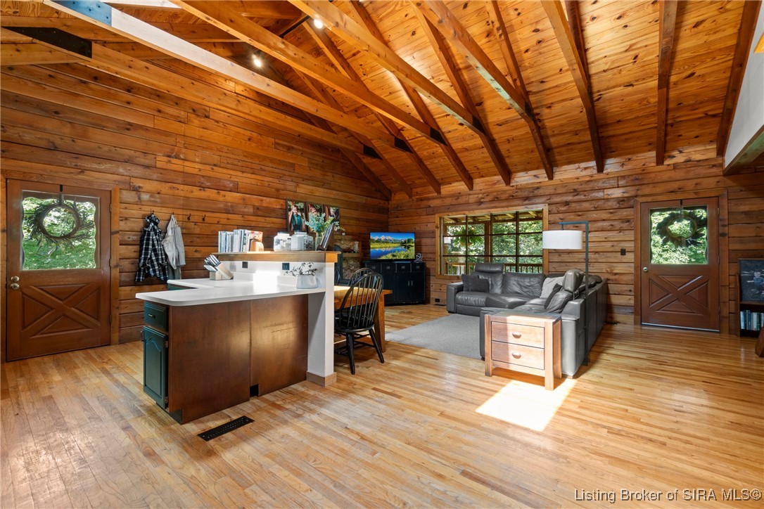 3895 Utz Road Northeast Georgetown, IN 47122 - Photo 70 of 70 Open floor plan showing kitchen, dining, and living room with vaulted ceilings.