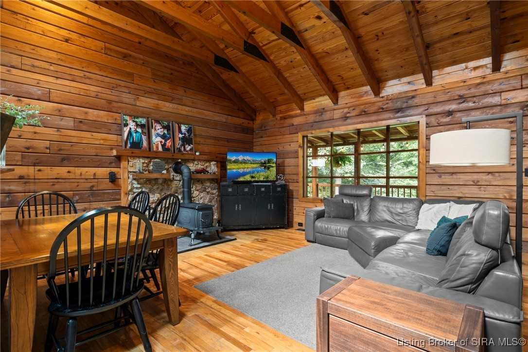 3895 Utz Road Northeast Georgetown, IN 47122 - Photo 16 of 70 Dining and living area with warm wood tones and large window views.