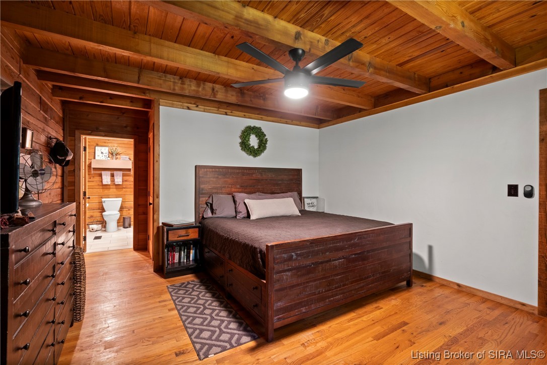 3895 Utz Road Northeast Georgetown, IN 47122 - Photo 18 of 70 Primary Bedroom with En Suite Access – Features matching wood finishes, ceiling fan lighting, and direct entry to a private bath.