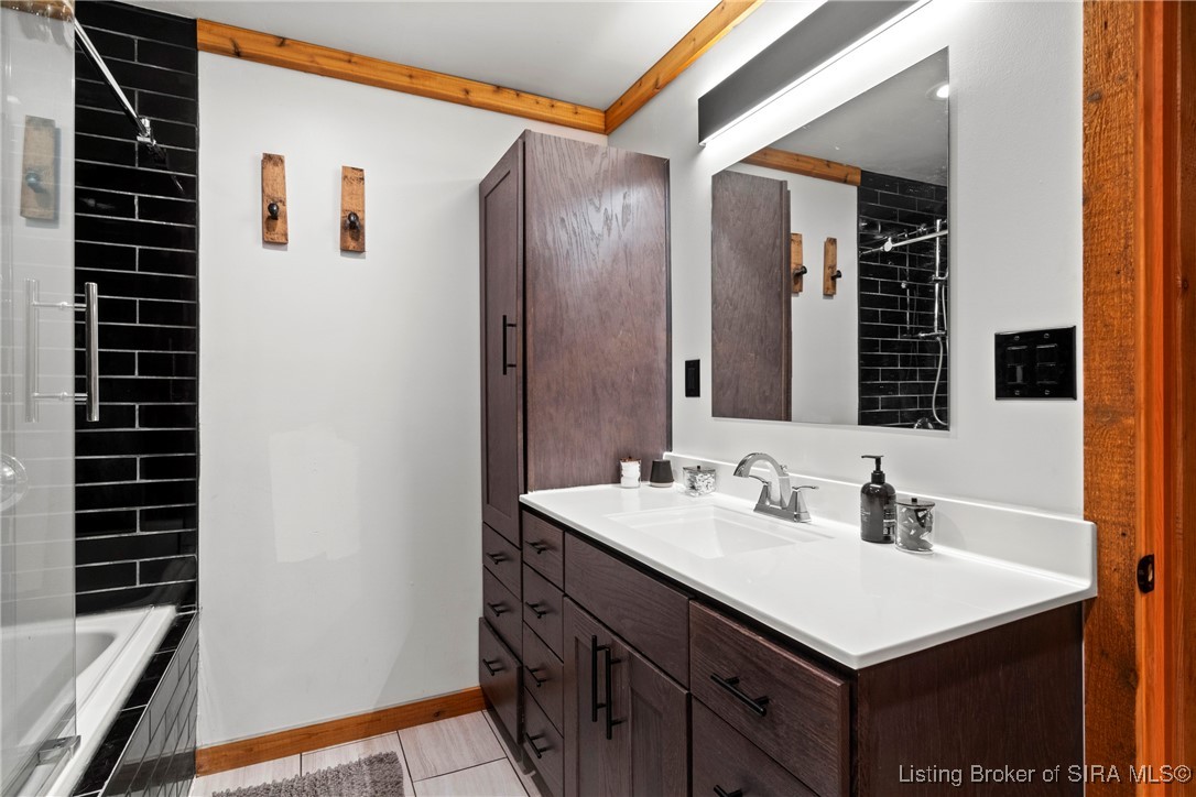 3895 Utz Road Northeast Georgetown, IN 47122 - Photo 22 of 70 Primary Bathroom Vanity – Double-sink vanity with abundant storage and contemporary hardware.