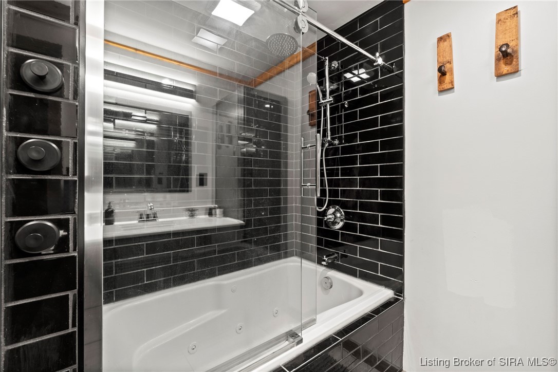 3895 Utz Road Northeast Georgetown, IN 47122 - Photo 23 of 70 Shower and Tub Detail – Sleek black tile with built-in jets and glass door enclosure.